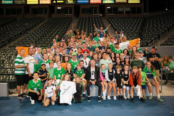 photo of a group of people at a sports venue