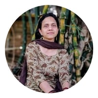 a photo of a woman with brown scarf. An author named Renuka Tandon