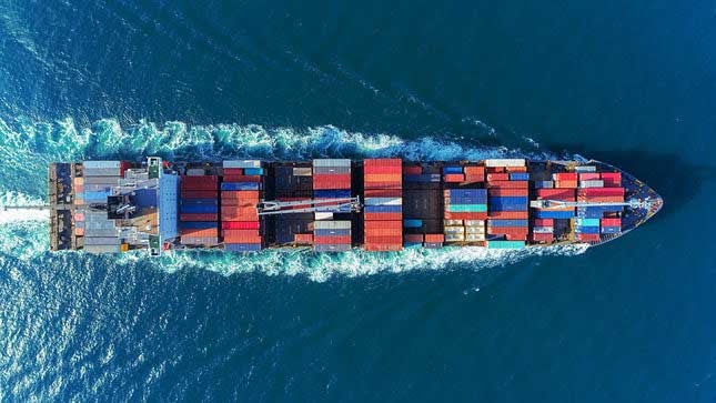 a-cargo-boat-carrying-boxes-on-the-water