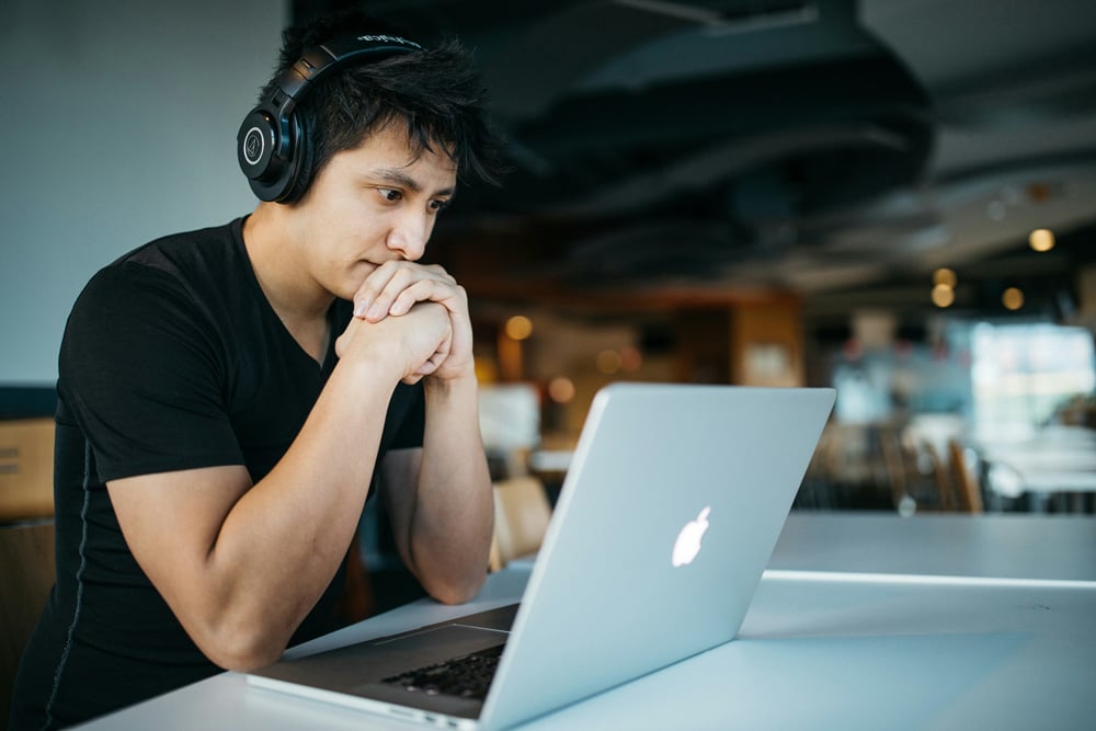 a-man-looking-at-his-computer