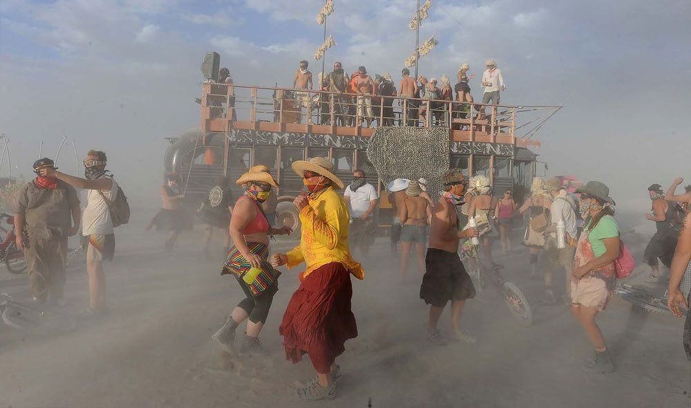 group of people dancing in the burning man event